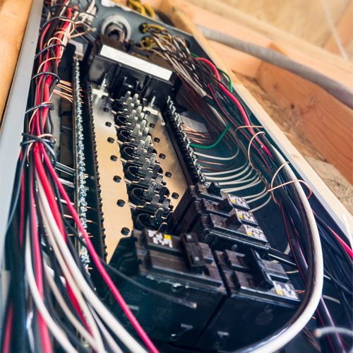 You need to get a professional electrical inspection prior to making any changes to the room to ensure that the panel box is able to handle the additional load. 