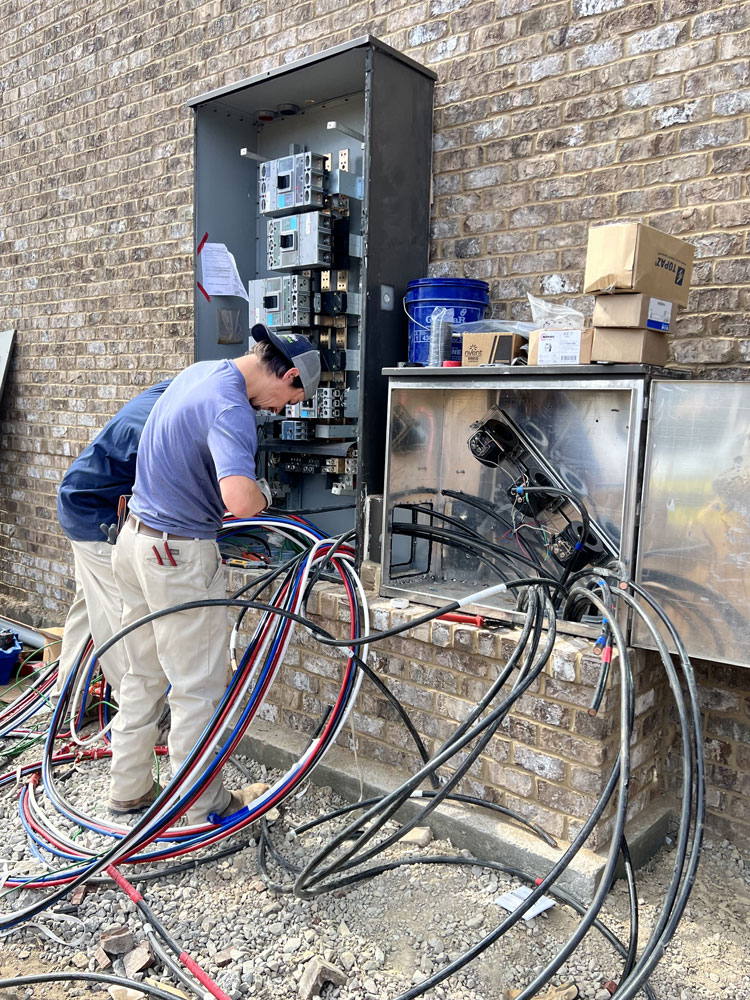 Rytec technician upgrading huge commercial breaker box